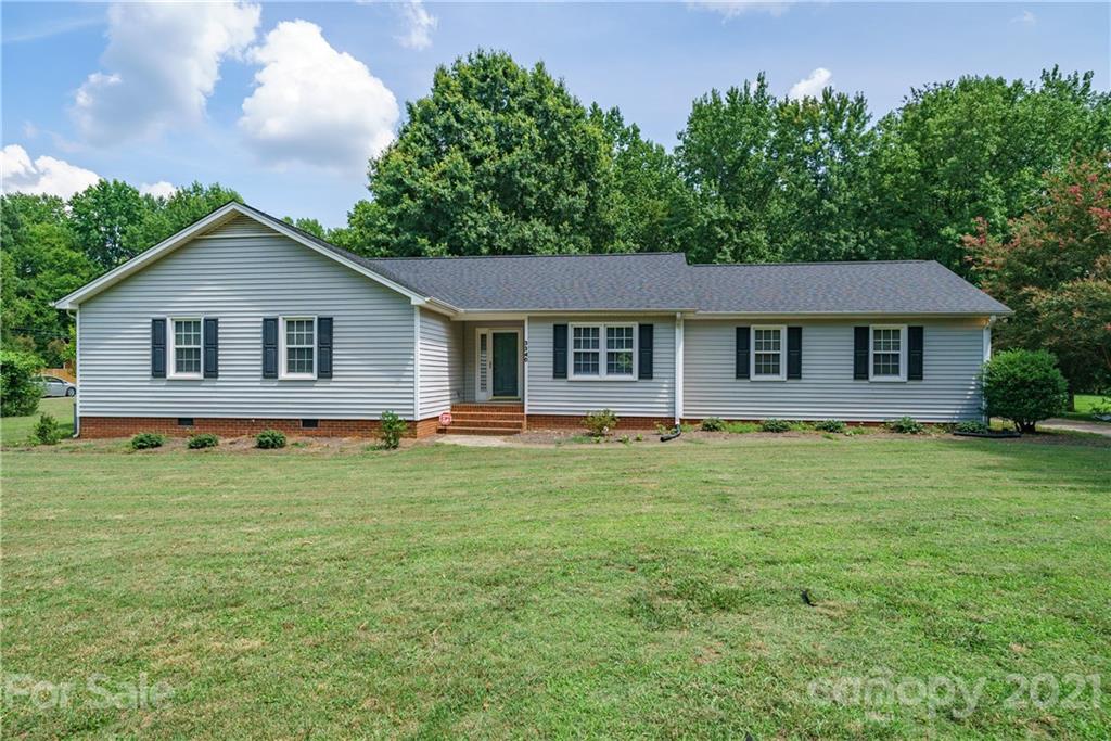 3340 Dan Hood Road Matthews, NC 28105 - Photo 1 of 48 a house with a yard