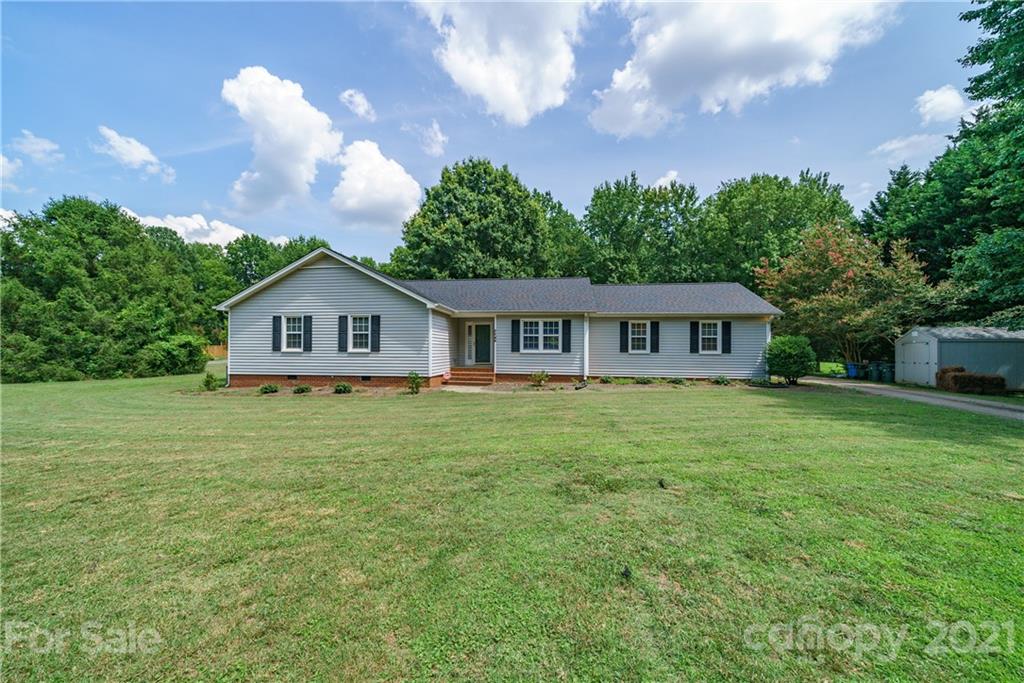 3340 Dan Hood Road Matthews, NC 28105 - Photo 2 of 48 a front of a house with a yard and trees