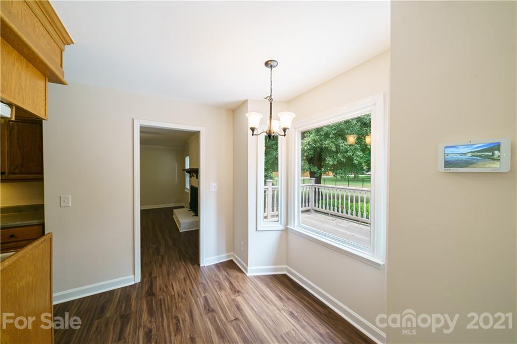 3340 Dan Hood Road Matthews, NC 28105 - Photo 14 of 48 a view of hallway with livingroom and wooden floor