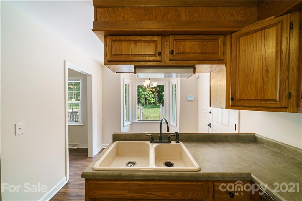 3340 Dan Hood Road Matthews, NC 28105 - Photo 19 of 48 a kitchen with a sink and a window