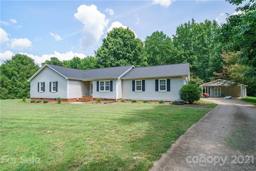 3340 Dan Hood Road Matthews, NC 28105 - Photo 3 of 48 a front view of a house with a yard