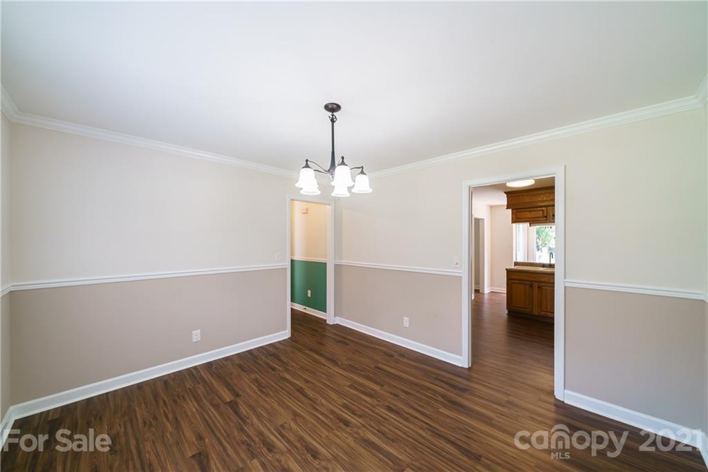 3340 Dan Hood Road Matthews, NC 28105 - Photo 23 of 48 wooden floor in an empty room with a window