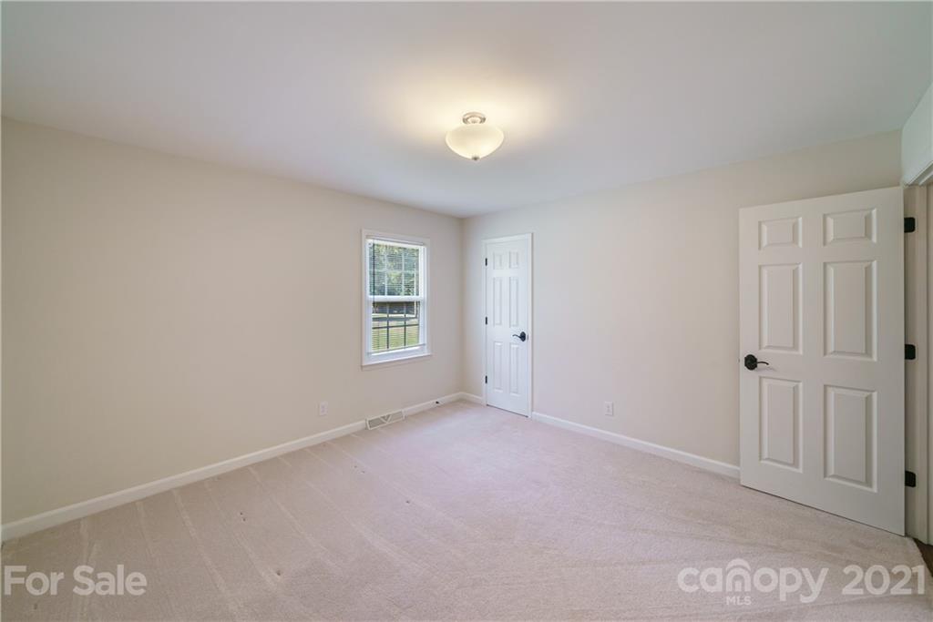 3340 Dan Hood Road Matthews, NC 28105 - Photo 27 of 48 a view of an empty room with a window
