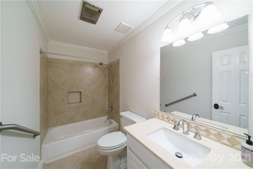 3340 Dan Hood Road Matthews, NC 28105 - Photo 28 of 48 a bathroom with a sink a toilet and shower