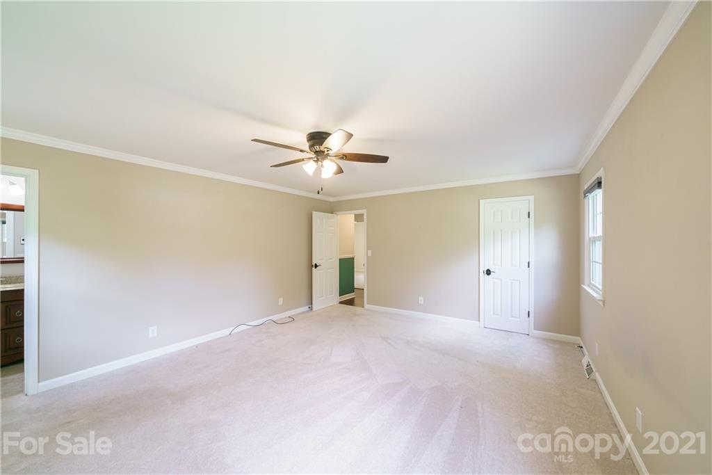 3340 Dan Hood Road Matthews, NC 28105 - Photo 33 of 48 a view of an empty room with a ceiling fan