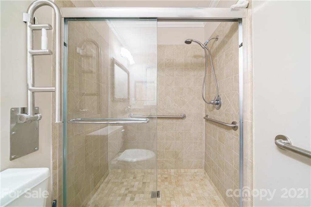 3340 Dan Hood Road Matthews, NC 28105 - Photo 36 of 48 a bathroom with a shower and a mirror