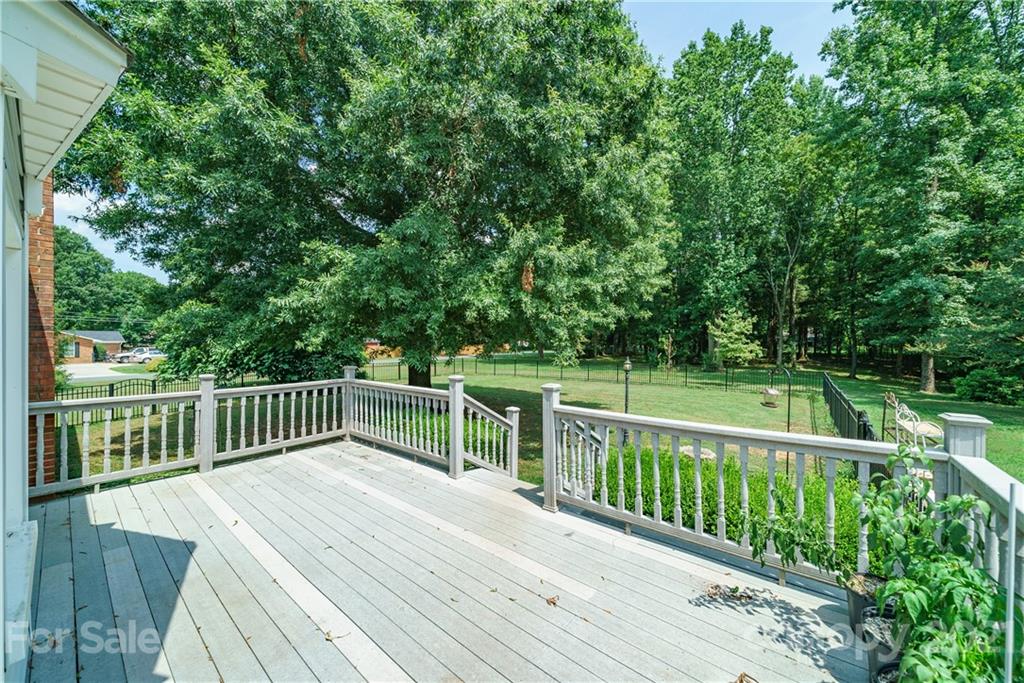 3340 Dan Hood Road Matthews, NC 28105 - Photo 39 of 48 a view of a deck with two chairs and wooden fence