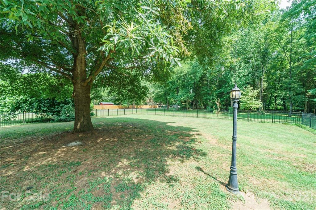 3340 Dan Hood Road Matthews, NC 28105 - Photo 40 of 48 a view of a park with a tree