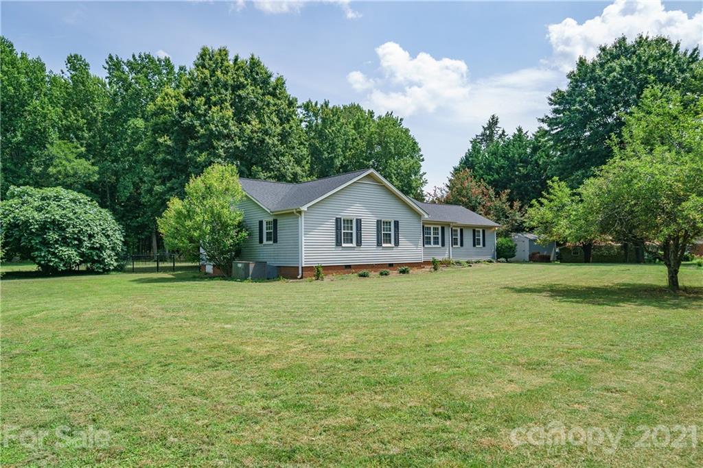 3340 Dan Hood Road Matthews, NC 28105 - Photo 44 of 48 a front of a house with a garden