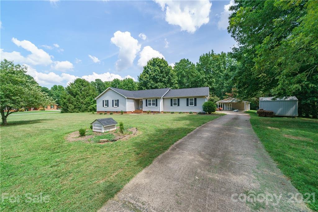 3340 Dan Hood Road Matthews, NC 28105 - Photo 46 of 48 a front view of house with yard and green space