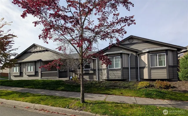 a front view of a house with a garden