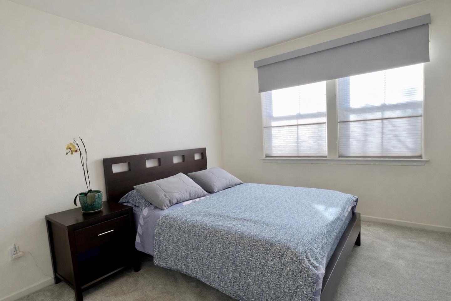 1310 Saddle Rack Street, Unit 347 San Jose, CA 95126 - Photo 22 of 42 a bedroom with a bed and window