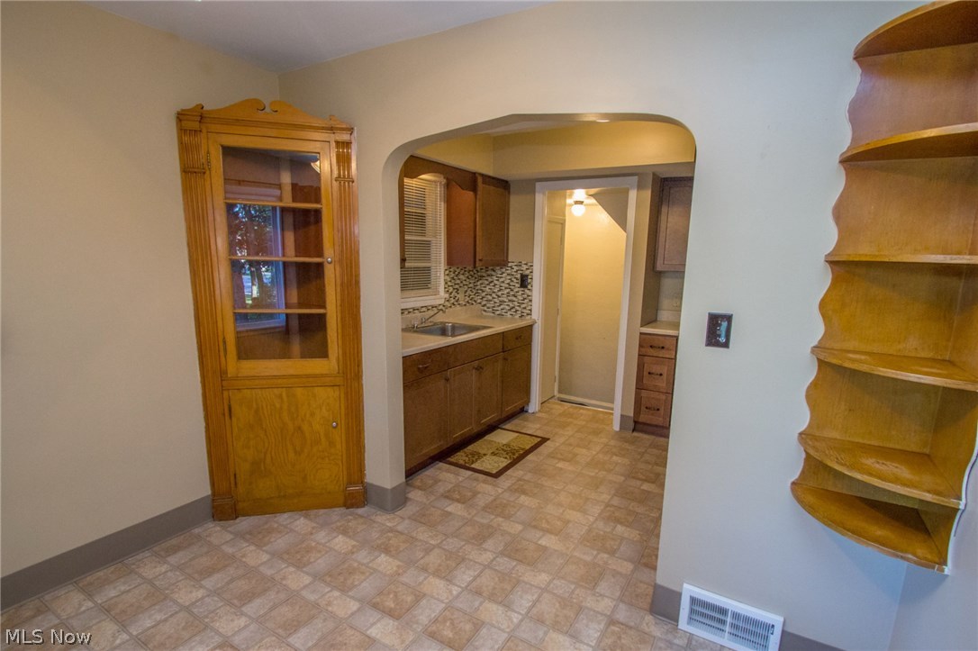 7730 Broadview Road Cleveland, OH 44134 - Photo 8 of 18 Built-in China Cabinets and shelving in the eat-in kitchen area.