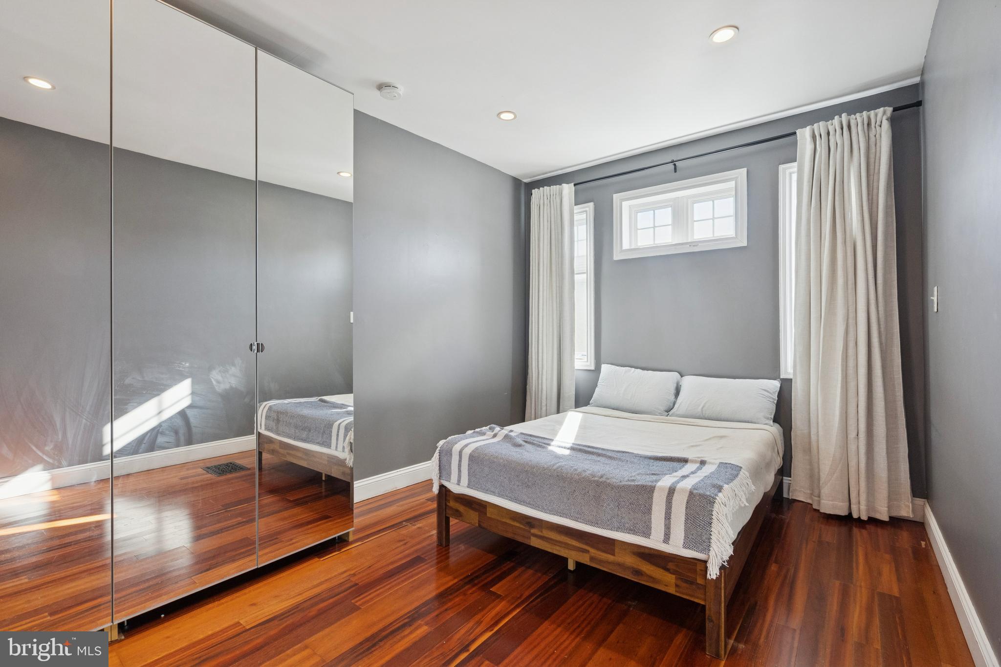 2936 Poplar Street Philadelphia, PA 19130 - Photo 16 of 27 a bedroom with a bed and a table