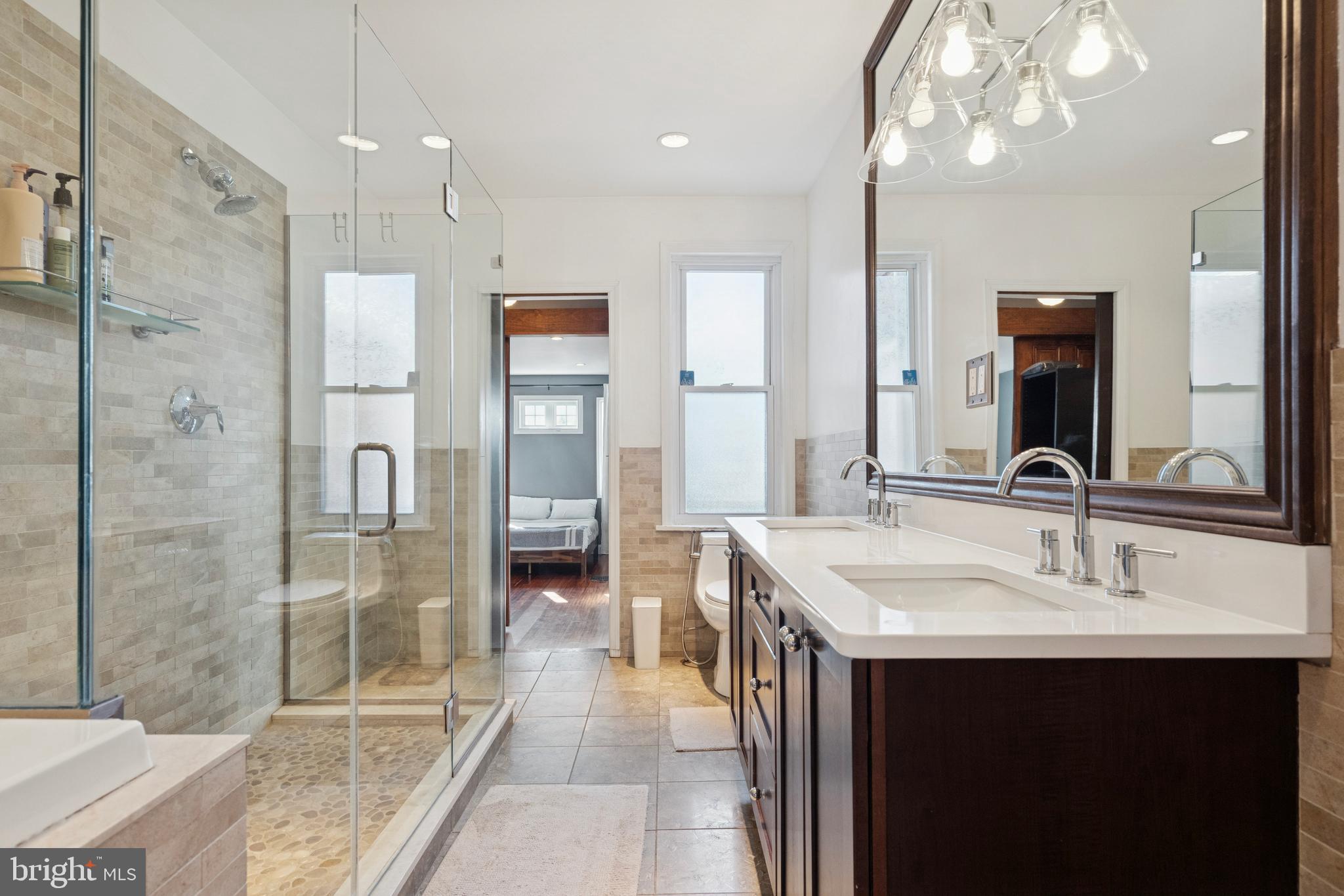 2936 Poplar Street Philadelphia, PA 19130 - Photo 19 of 27 a bathroom with a sink double vanity and shower