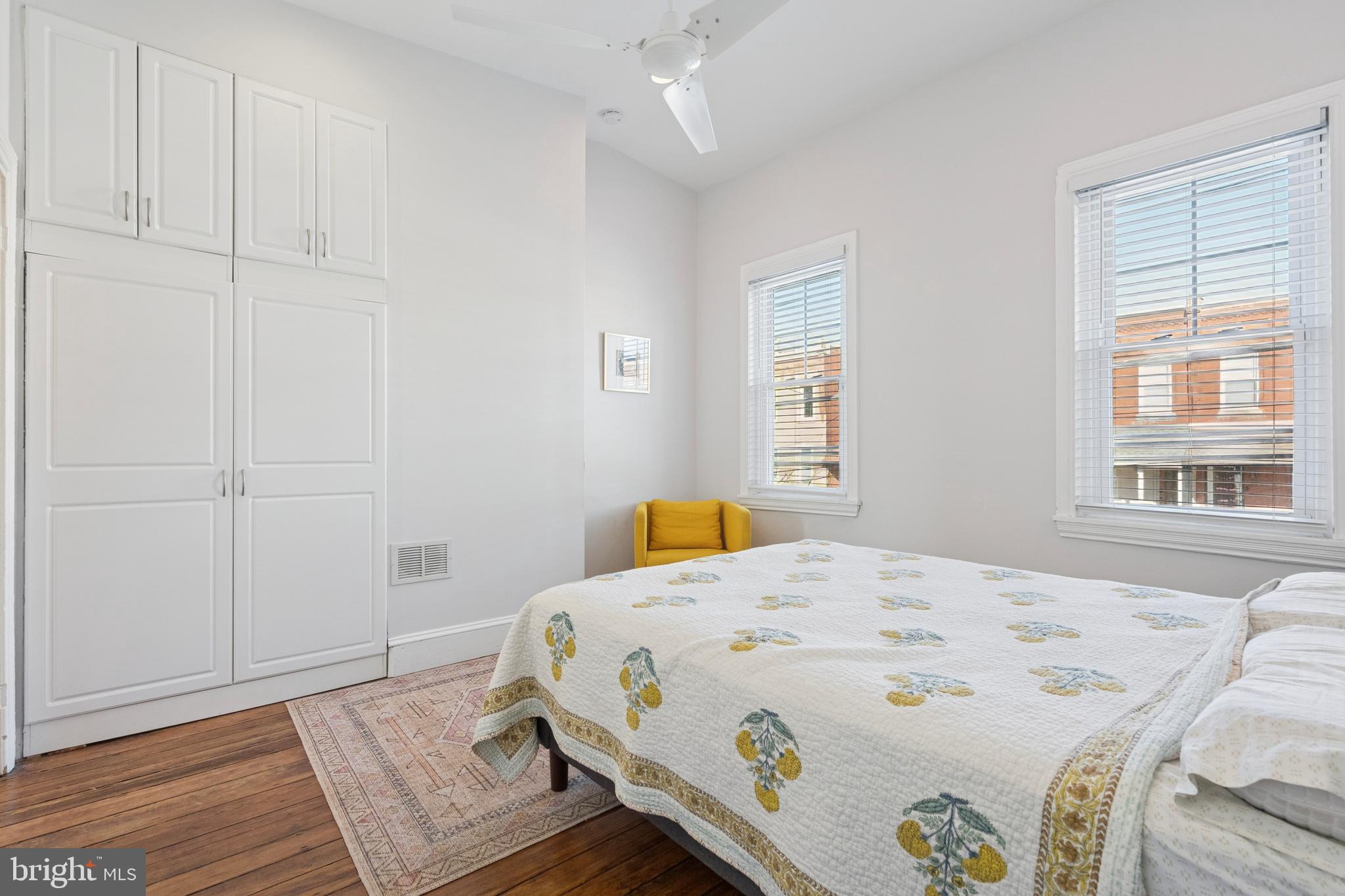2936 Poplar Street Philadelphia, PA 19130 - Photo 21 of 27 a bedroom with a bed and wooden floor