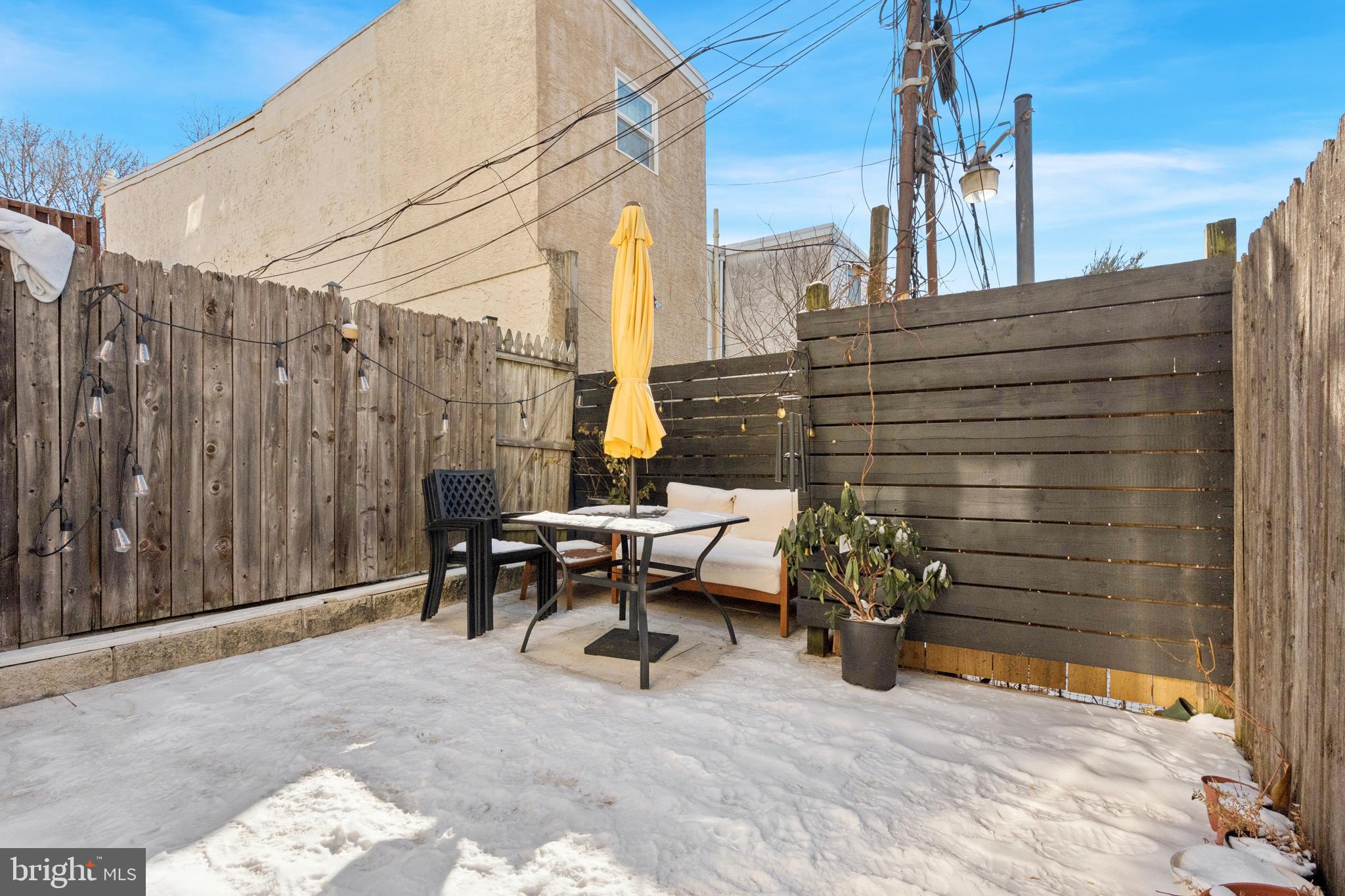 2936 Poplar Street Philadelphia, PA 19130 - Photo 25 of 27 a backyard of a house with barbeque oven table and chairs