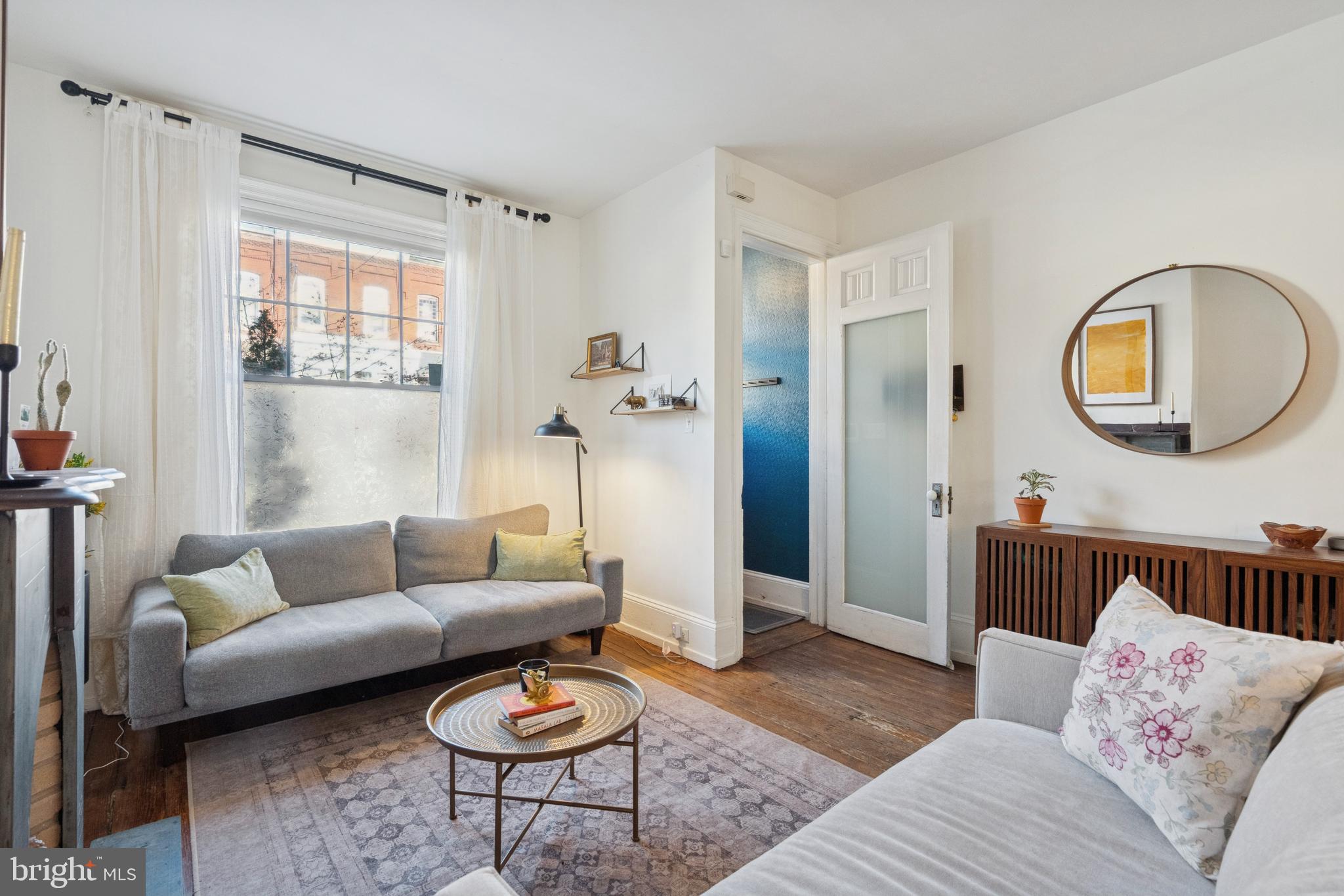 2936 Poplar Street Philadelphia, PA 19130 - Photo 4 of 27 a living room with furniture and a window