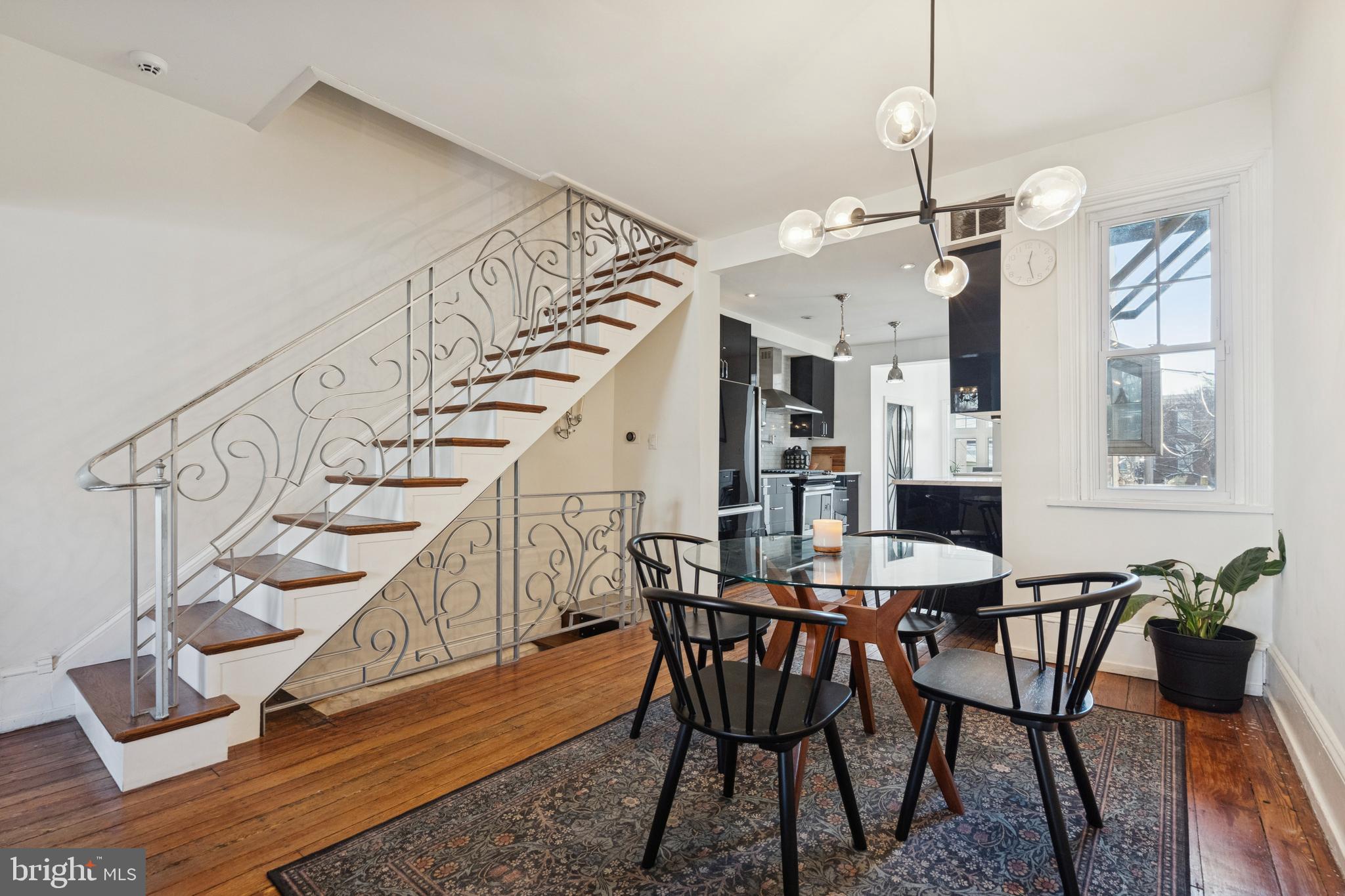 2936 Poplar Street Philadelphia, PA 19130 - Photo 6 of 27 a view of a dining room with furniture wooden floor and chandelier