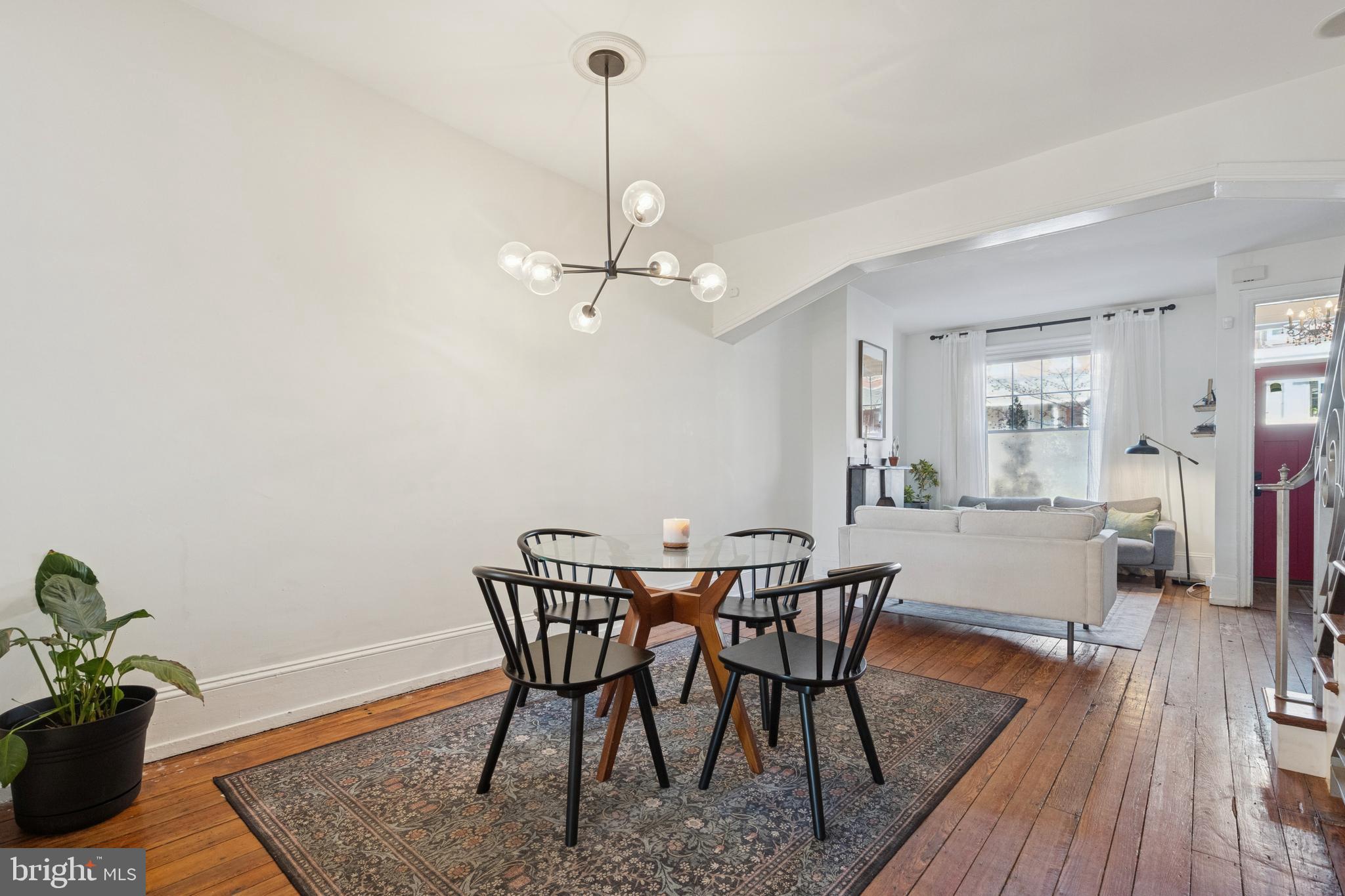 2936 Poplar Street Philadelphia, PA 19130 - Photo 8 of 27 a view of a dining room with furniture and wooden floor