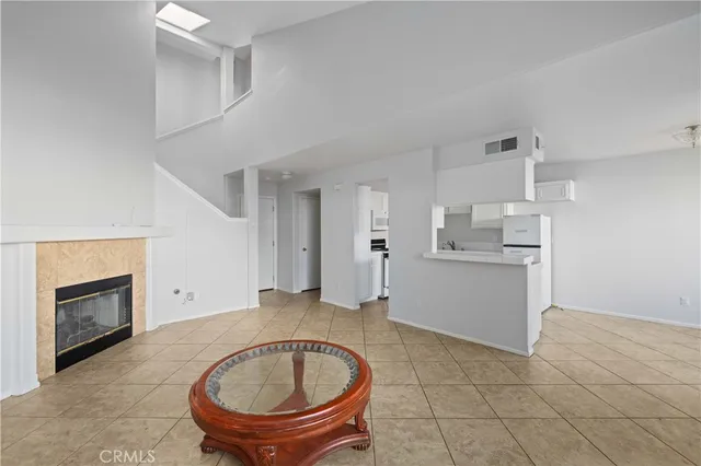 a view of a kitchen with a sink and a living room
