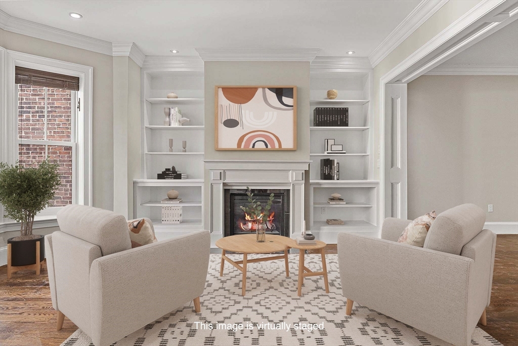 410 Boylston Street, Unit 3 Boston, MA 02116 - Photo 1 of 20 a living room with furniture and a fireplace