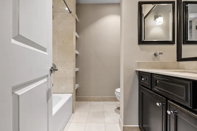 a bathroom with a sink a mirror and a toilet