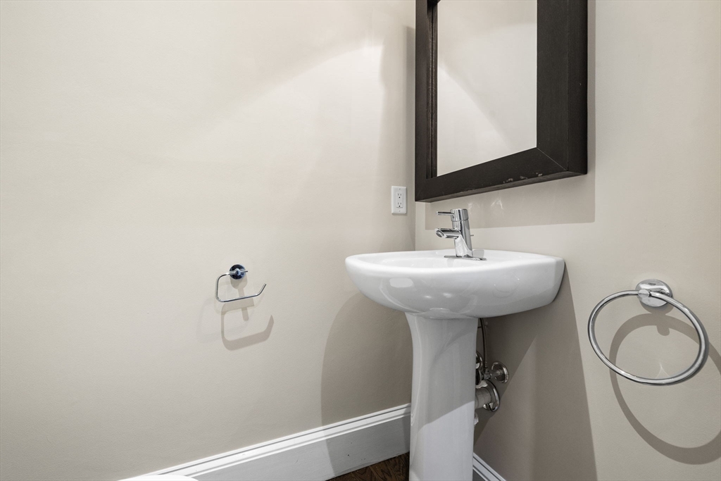 410 Boylston Street, Unit 3 Boston, MA 02116 - Photo 8 of 20 a bathroom with a sink a toilet and a mirror