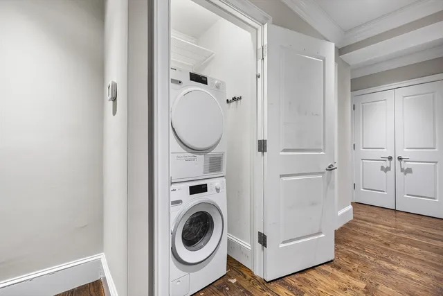 a view of a hallway with washer and dryer