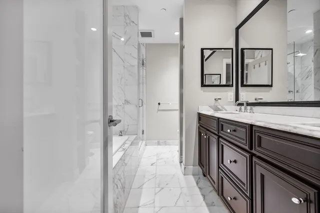 a bathroom with a sink a vanity and a mirror