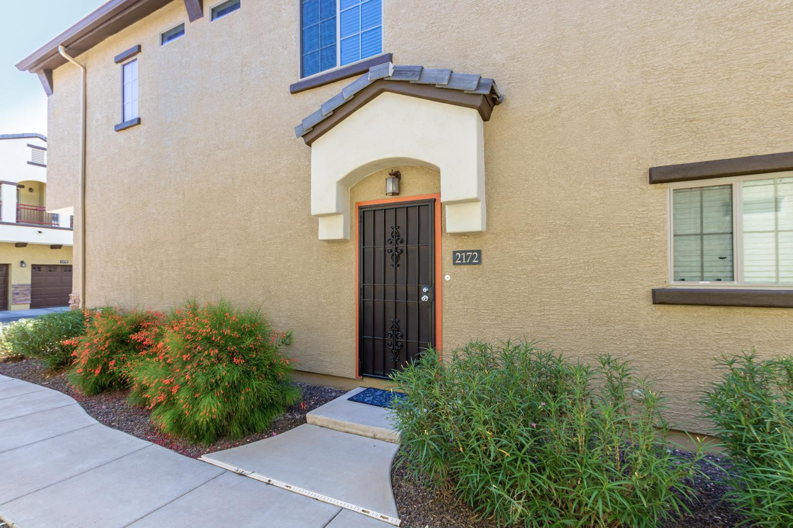 2725 East Mine Creek Road, Unit 2172 Phoenix, AZ 85024 - Photo 3 of 28 a front view of a house with garden