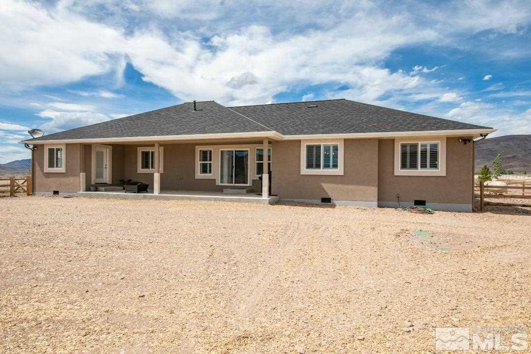100 James Ranch Court Reno, NV 89510 - Photo 3 of 20 a front view of house with yard and trees in the background