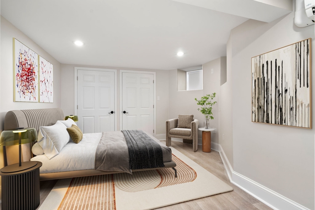 5 Albemarle Street, Unit 1 Boston, MA 02115 - Photo 4 of 5 a bedroom with a bed and a couch