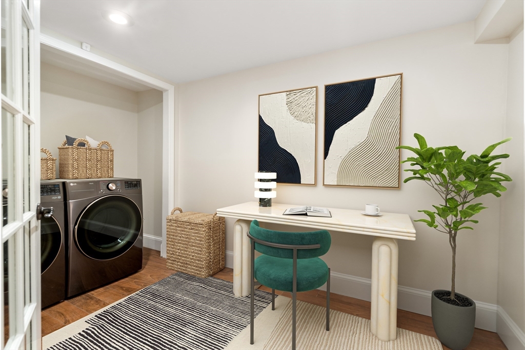 5 Albemarle Street, Unit 1 Boston, MA 02115 - Photo 5 of 5 a view of a livingroom with washer and dryer