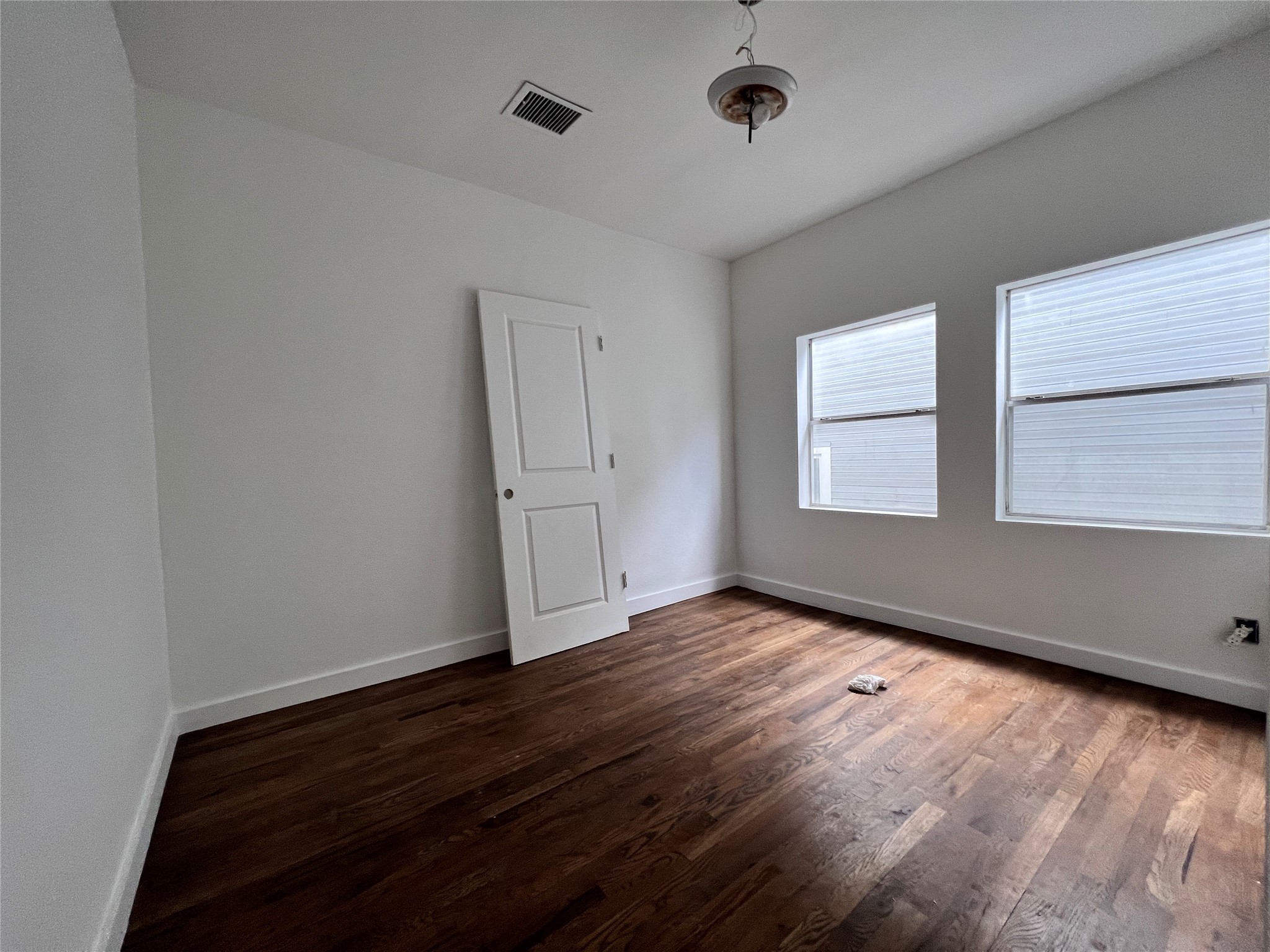 415 Fairview Street, Unit 8 Houston, TX 77006 - Photo 2 of 19 Primary bedroom with large picture windows, allowing natural light to flood the room.