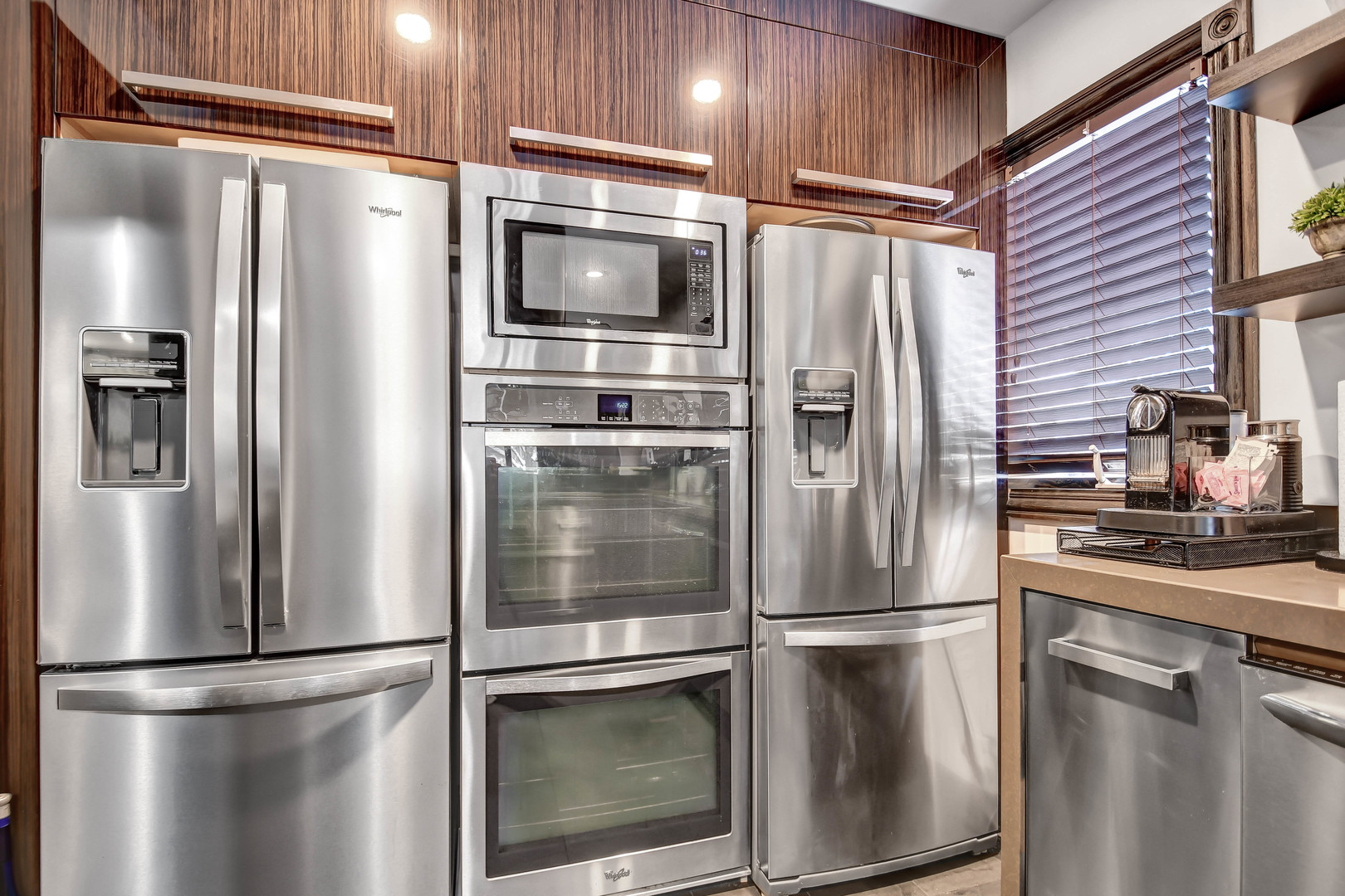 491 Old Surrey Road, Unit A Hinsdale, IL 60521 - Photo 12 of 23 a metallic refrigerator freezer and a stove sitting inside of a kitchen