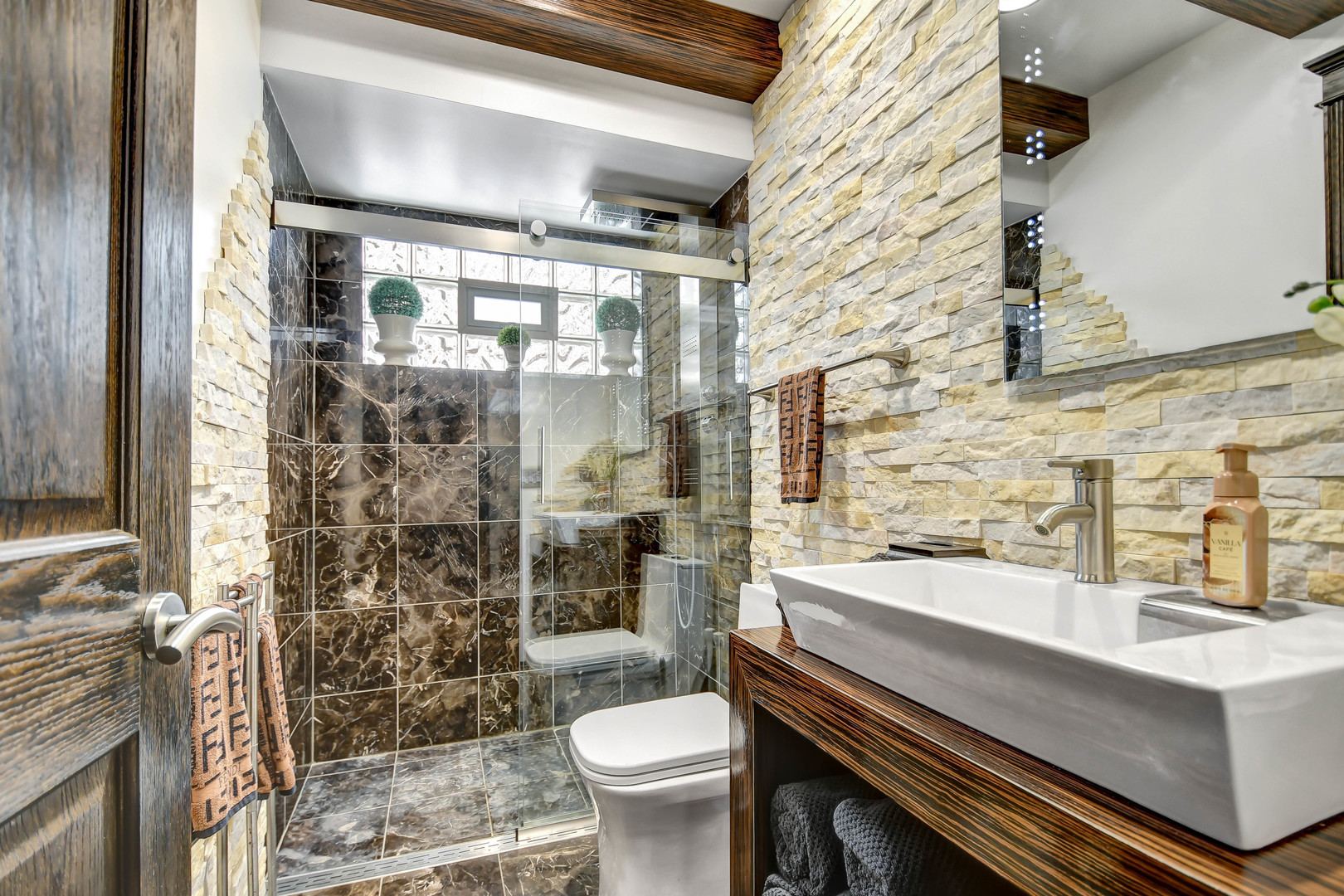 491 Old Surrey Road, Unit A Hinsdale, IL 60521 - Photo 14 of 23 a bathroom with a sink a toilet and shower