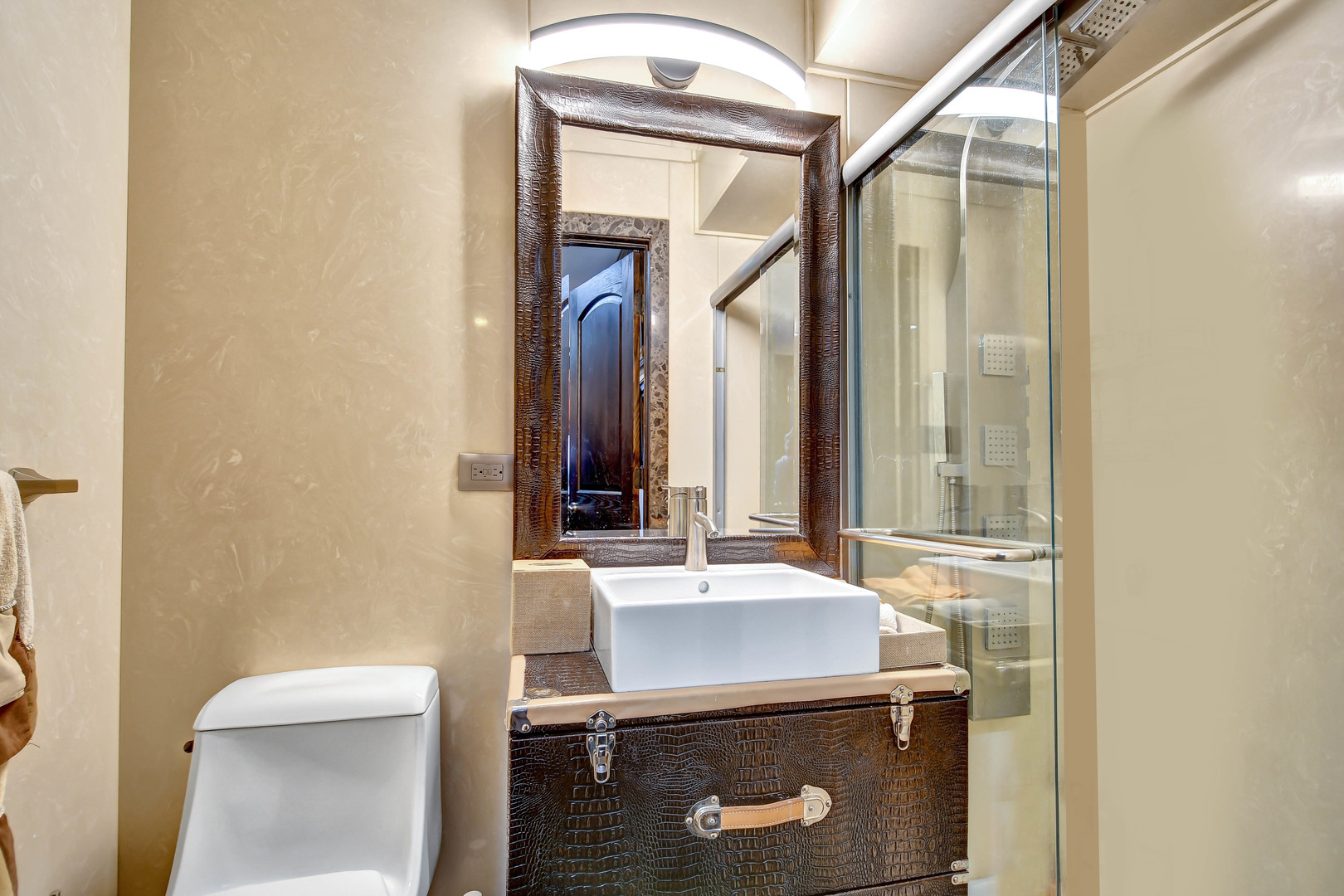 491 Old Surrey Road, Unit A Hinsdale, IL 60521 - Photo 16 of 23 a bathroom with a sink a toilet and mirror