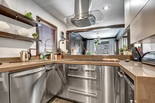 a kitchen with a stove and a sink