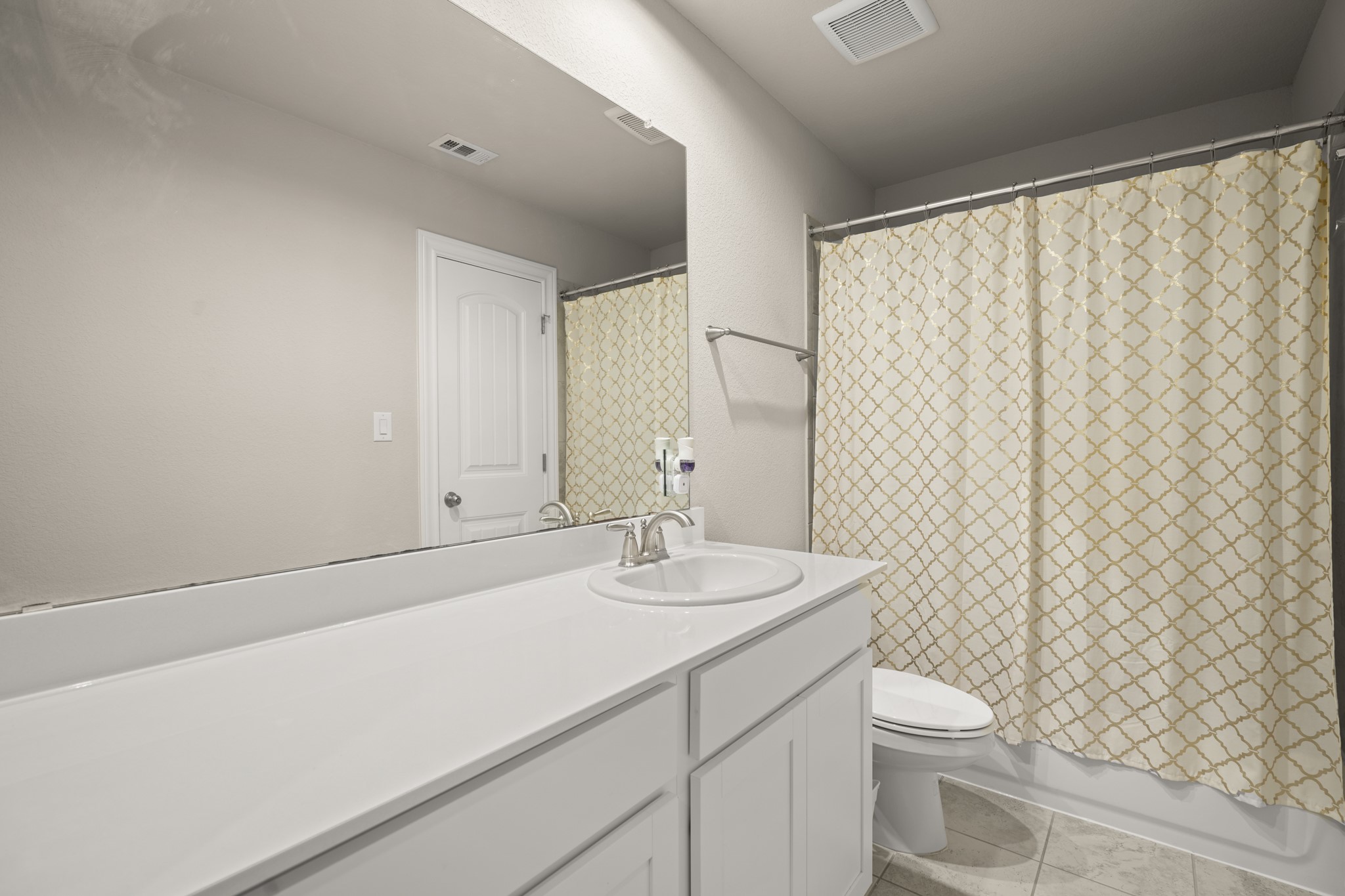 2209 Hat Bender Loop Round Rock, TX 78664 - Photo 19 of 25 a bathroom with a sink a toilet and shower curtain