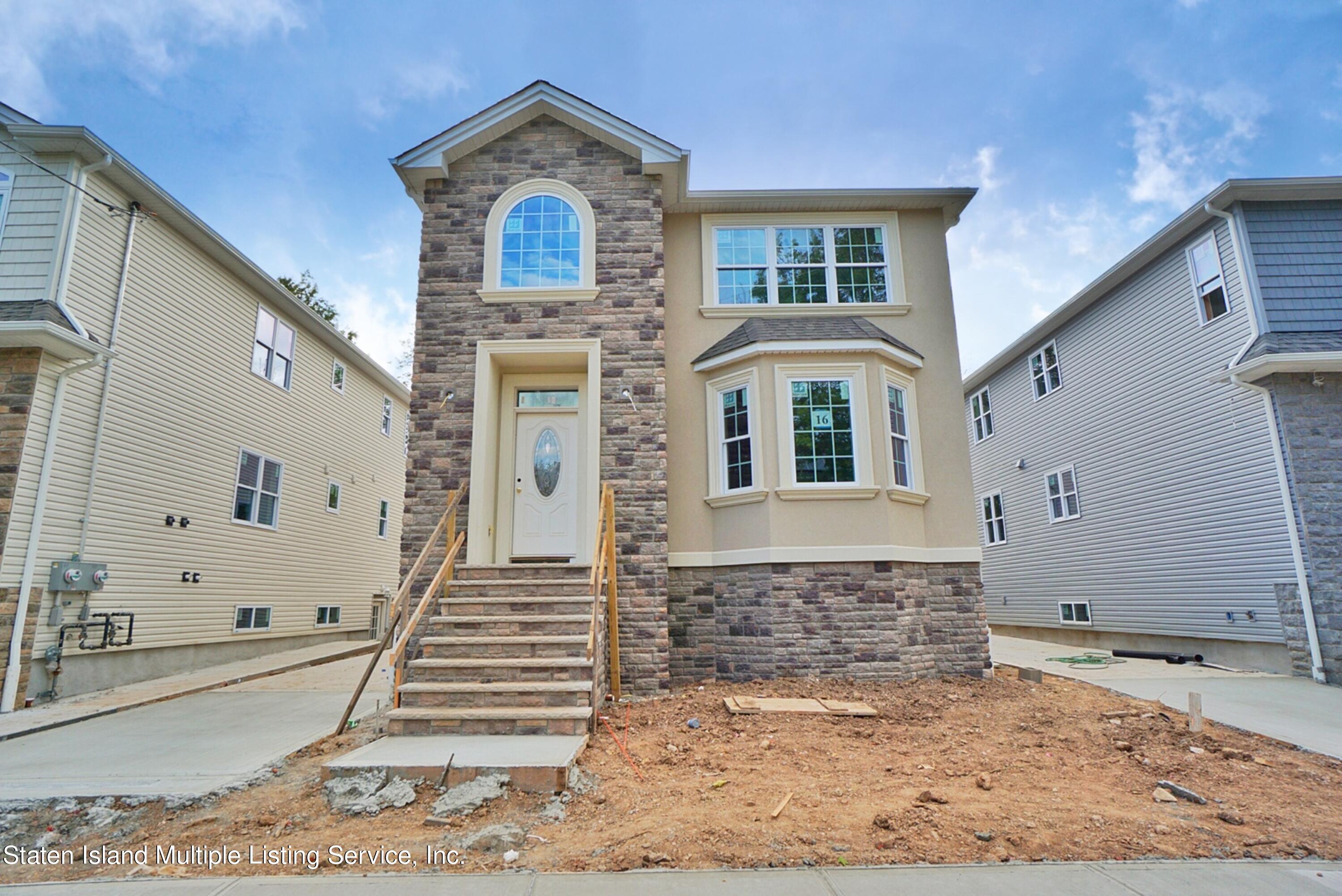 16 Eugene Street Staten Island, NY 10309 - Photo 1 of 6 a front view of a house with a yard