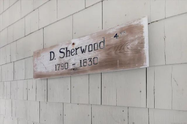 a spacious bathroom with a vanity a sink a mirror and a bathtub