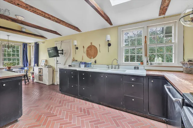 a kitchen with sink cabinets and outdoor seating