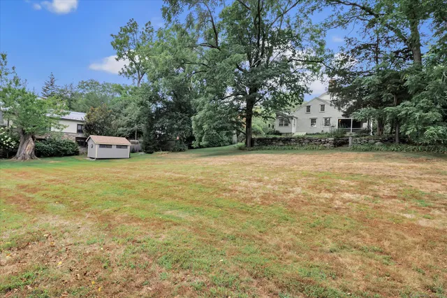 a view of a field with a sitting area