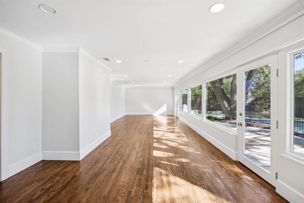 6848 Midcrest Drive Dallas, TX 75254 - Photo 14 of 38 a view of a room with wooden floor and windows