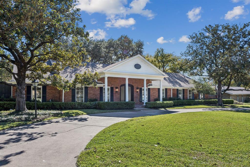 6848 Midcrest Drive Dallas, TX 75254 - Photo 2 of 38 a front view of house with yard and green space