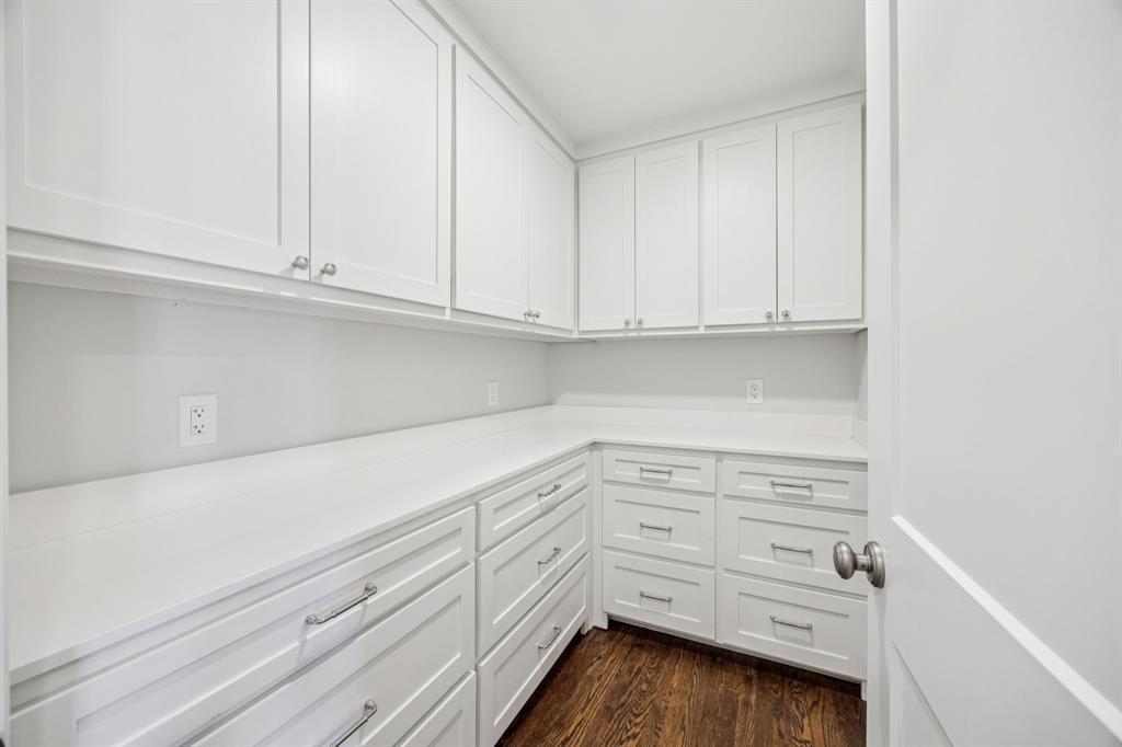 6848 Midcrest Drive Dallas, TX 75254 - Photo 28 of 38 a kitchen with white cabinets and white appliances