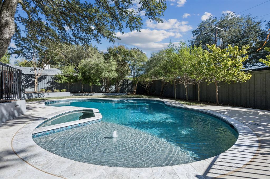 6848 Midcrest Drive Dallas, TX 75254 - Photo 30 of 38 a view of a swimming pool with a sitting area