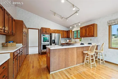 a view of backyard with a deck