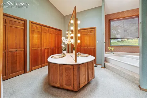 a livingroom with workspace and a couch